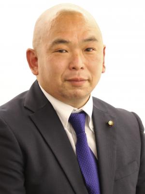 村越議員顔写真